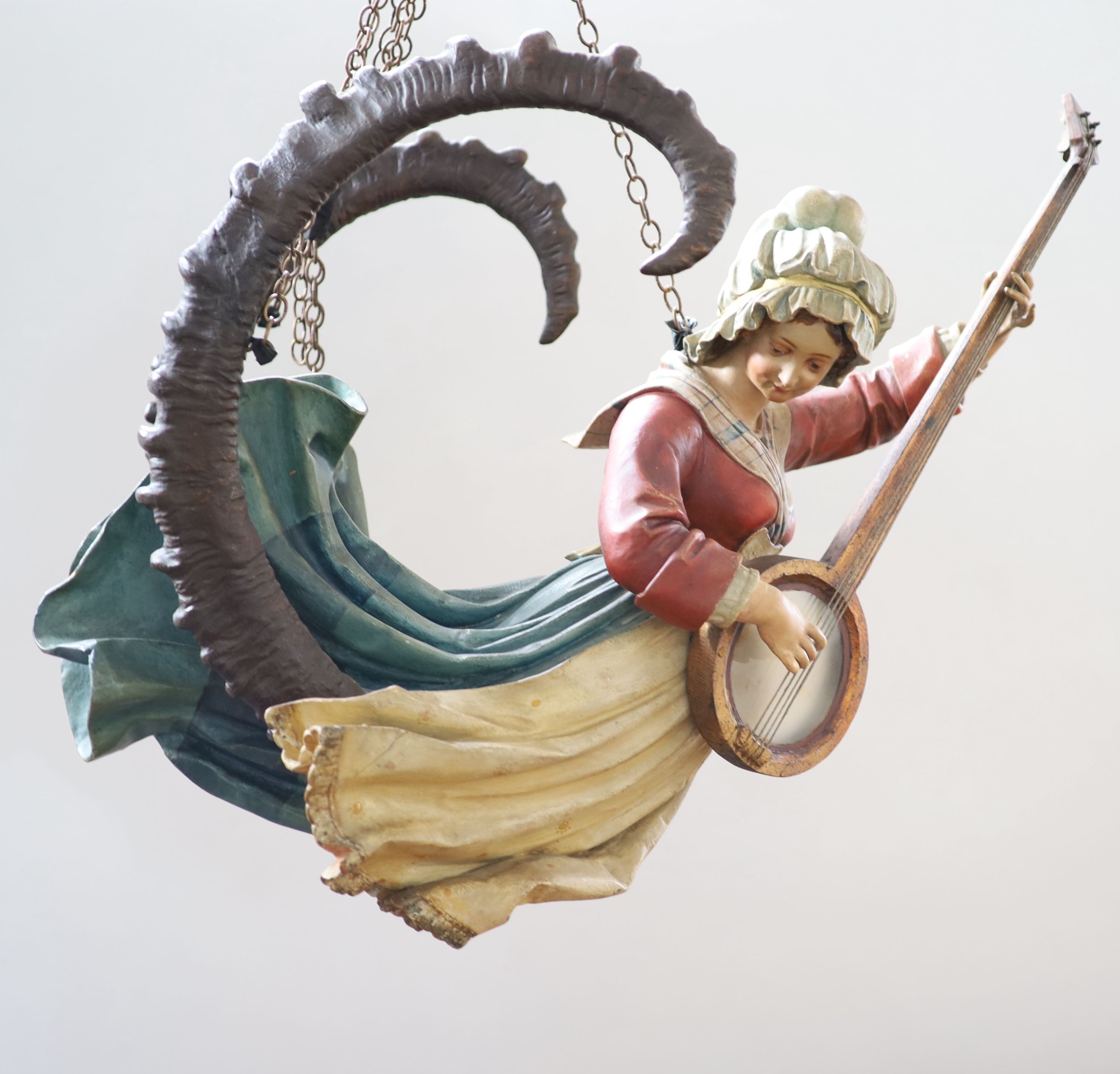 A late 19th century carved and painted wood Lusterweibchen H 60cm. W 80cm.